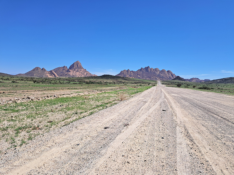 SUV and 4x4 vehicles on Namibia gravel road — car hire comparison